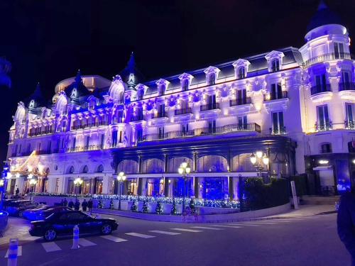 a building with purple lights on the front of it at Ezevacances Studio Capuccino vue mer 5 mn plage 7 mn gare Wifi in Èze