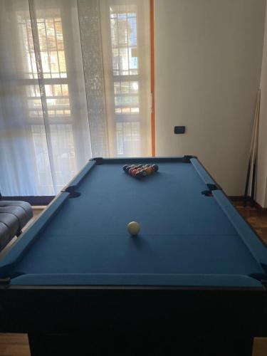 a pool table with a ball on top of it at CasaPratti Pescara centro in Pescara
