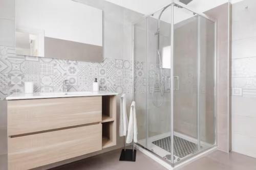 a bathroom with a shower and a sink at Poste Rooms 28 in Sava