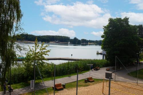 a view of a large lake with a dock at Olimpijska by RENT4YOU in Olsztyn