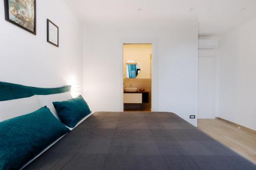 a room with a bed with a couch and a table at Maison Lorelle - De Vivo Realty Sorrento in Sorrento