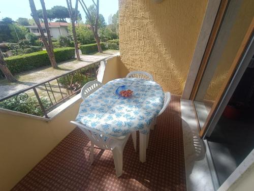 a table and chairs on a balcony with a view at L'Orchidea_Holiday in Camaiore