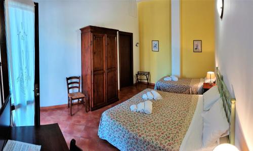 Una cama o camas en una habitación de Agriturismo Le Chiuse