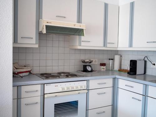 Η κουζίνα ή μικρή κουζίνα στο Caslano City Apartments
