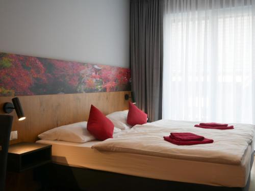 Postel nebo postele na pokoji v ubytování Hotel Linde-Sinohaus