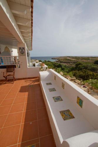 a balcony of a house with a view of the ocean at Aura - Le due Lune in Lampedusa