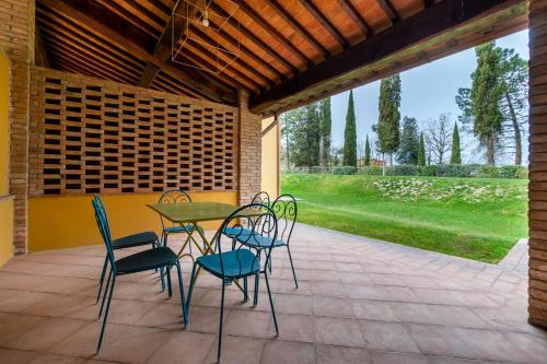 a table and chairs sitting on a patio at Boccioleto Resort - Place of Charme in Montaione