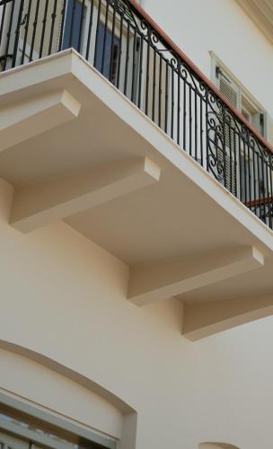 a stairwell of a building with a railing at Impero Nafplio Hotel & Suites in Nafplio