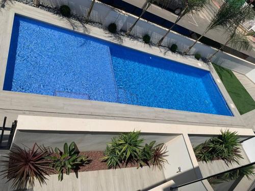 Πισίνα στο ή κοντά στο SUNtiago Apartment Residential Elisa