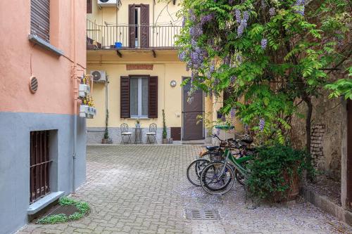 a group of bikes parked next to a building at Old Town Pavia in Pavia