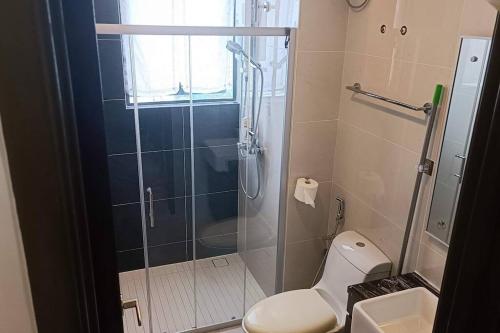 a bathroom with a shower with a toilet and a sink at Johor Bahru Danga Bay Country Garden 2BR 18 Home+ in Johor Bahru