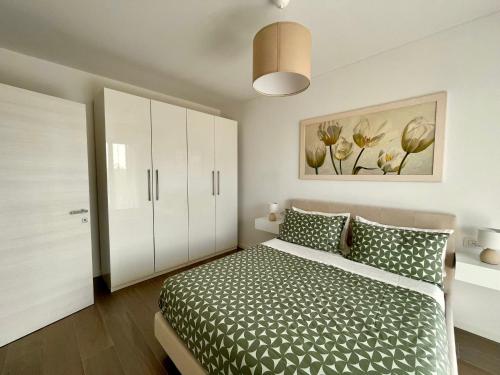 Säng eller sängar i ett rum på Stupendo appartamento in Fiera Milano-Up Town