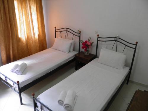 Ένα ή περισσότερα κρεβάτια σε δωμάτιο στο Delphi Hotel