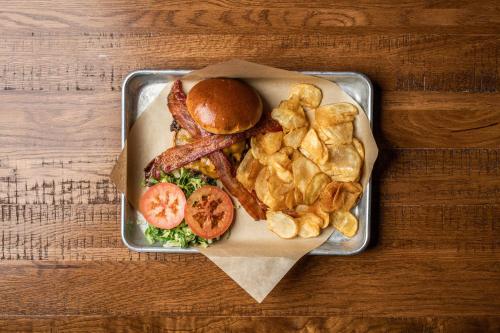 a tray of food with a sandwich and french fries at EverSpring Inn and Suites in Marshall
