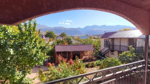 a view of a house from a balcony at Hotel Natalia in Kaji-Say