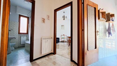 a hallway with a door leading to a bathroom at Casa Marina - Spacious Home in Rapallo in Rapallo