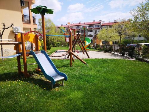a park with a playground with a slide at Sveti Vlas Sky Dreams Apartment in Sveti Vlas