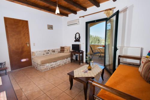 a living room with a couch and a table at Sivas Apartments-Studios,Sigelakis with very nice view in Sívas