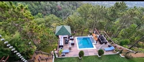 an aerial view of a house with a swimming pool at Montañas VIP Family Room in Constanza