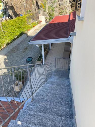 a group of stairs with a roof on a building at La Tonnara B&B in Palmi