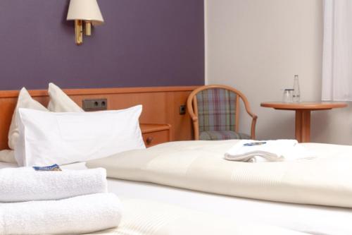 Ένα ή περισσότερα κρεβάτια σε δωμάτιο στο Hotel Kruse Zum Hollotal