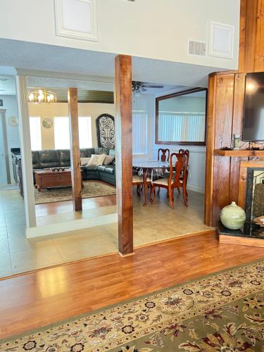 a living room with a table and a couch at Spacious and relaxing Home - Longwood, Florida in Orlando