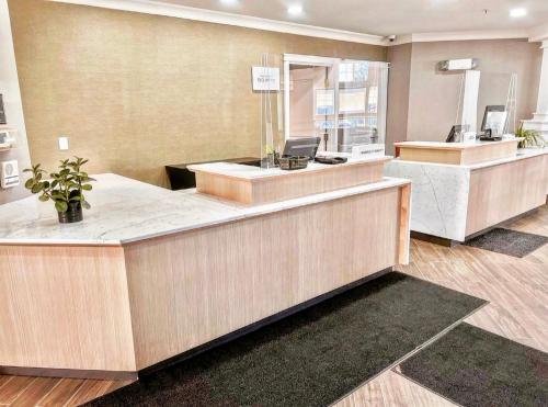 a lobby with a reception desk and a waiting area at Residence Inn by Marriott Whitby in Whitby