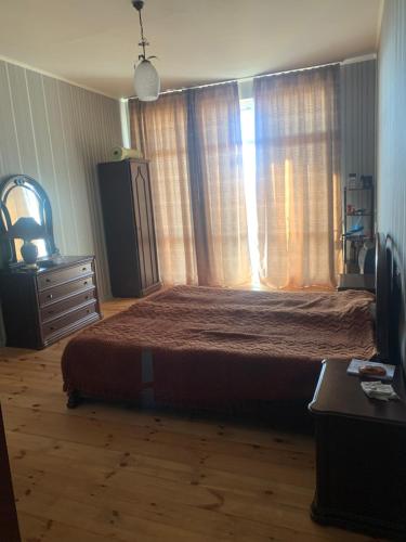 A bed or beds in a room at Dusheti23