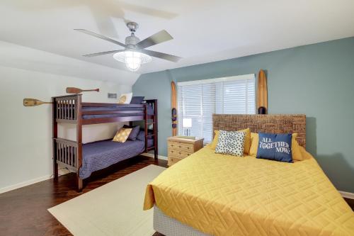 a bedroom with a bed and a crib at Hot Springs Vacation Rental with Pool Access and Deck! in Hot Springs