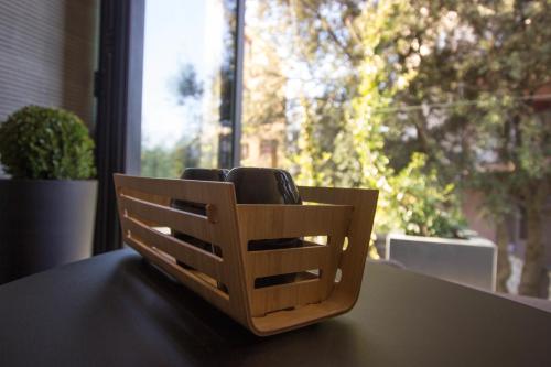 a wooden chair sitting on a table in front of a window at Boutique Hotel Valsabbion in Pula