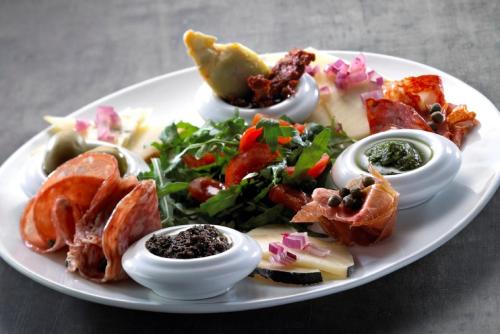 a plate of food with different types of food at Hotel Vista Mare & Spa - Aperto tutto l'anno in Cesenatico