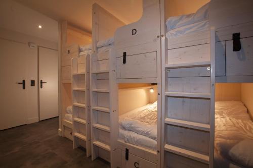 a group of bunk beds in a room at Le Maje Hostel in Montpellier