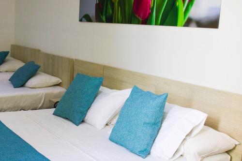 Postel nebo postele na pokoji v ubytování BGA Hotel