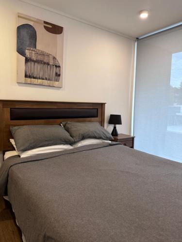 Ένα ή περισσότερα κρεβάτια σε δωμάτιο στο Apart Hotel Castellon 176