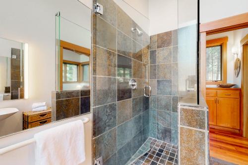 a bathroom with a shower with a glass door at Black Butte Ranch: Aspen Grove Retreat in Sisters