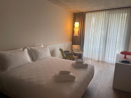 Ένα ή περισσότερα κρεβάτια σε δωμάτιο στο Hotel Giardino Verdi
