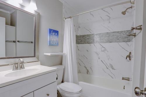 a bathroom with a sink toilet and a shower at Sea Cabin 131 B in Isle of Palms