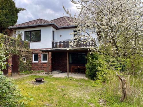a house with a deck on the side of it at Ferienwohnung Hitzacker/Elbe in Hitzacker