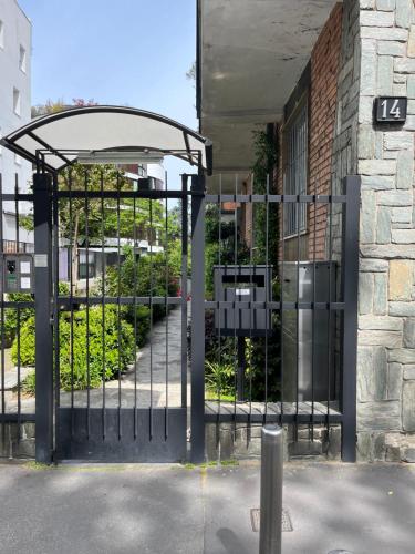 an entrance to a building with an iron gate at Suite Luxury [Duomo - SanSiro] in Milan