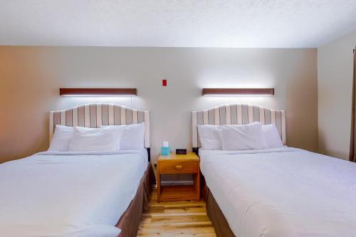 Ένα ή περισσότερα κρεβάτια σε δωμάτιο στο Baneberry Inn 3