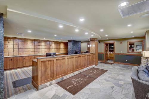 a lobby of a hotel with a reception desk at One Ski Hill, A RockResort in Breckenridge