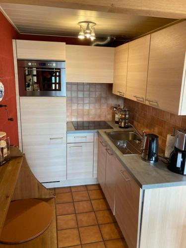 a kitchen with a sink and a counter top at Le Vieux Sart 3 in Stavelot