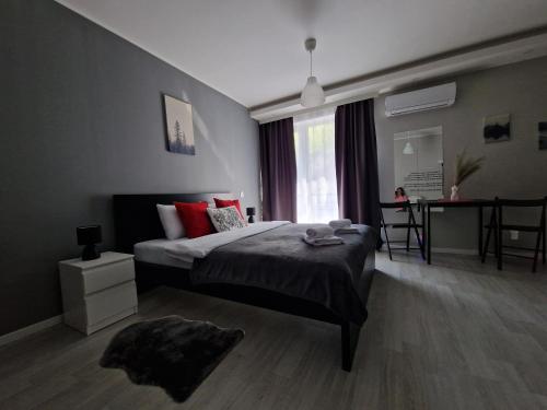 a bedroom with a large bed and a window at Horizont Dedine in Golubac