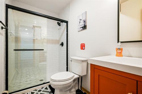 a bathroom with a shower and a toilet and a sink at 226 E Shore Dr in East Stroudsburg