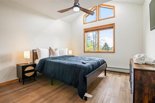 a bedroom with a bed and a ceiling fan at 226 E Shore Dr in East Stroudsburg