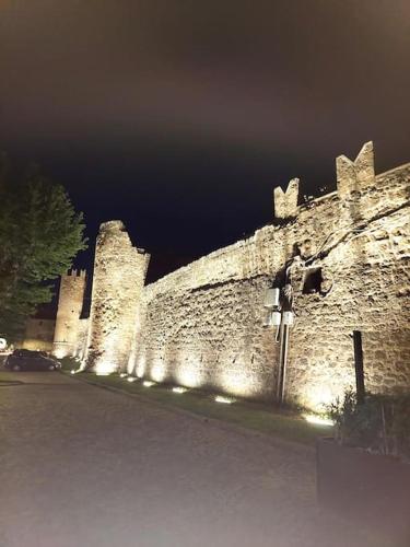 an old castle at night with lights on it at L'alloggio turistico di Zoe in Tuscania