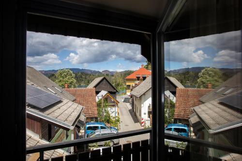 a view of a city from a window at Lakeside Apartments Bled in Bled