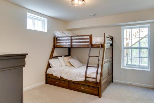 a bedroom with bunk beds in a house at Lake Anna Vacation Rental with Private Hot Tub! in Kirk O'Cliff
