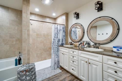 a bathroom with two sinks and a tub and a shower at Pet-Friendly Lingle Ranch with Deck on 60 Acres! 