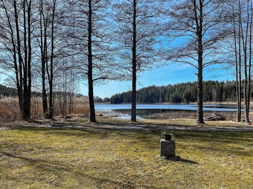a park with trees and a body of water at 4 person holiday home in ASKERSUND-By Traum in Askersund
